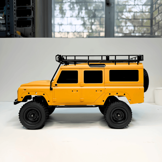 Front perspective view of the yellow MN Model MN-111C RC crawler for wholesale inventory restocking across India
