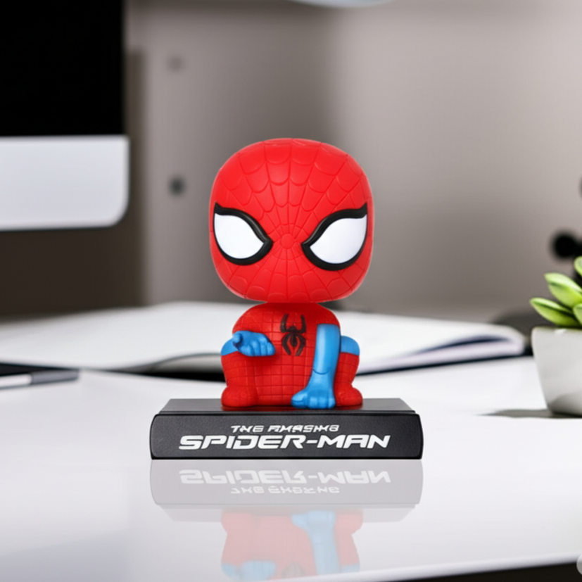 Spider-Man figurine on a car dashboard with a blurred background
